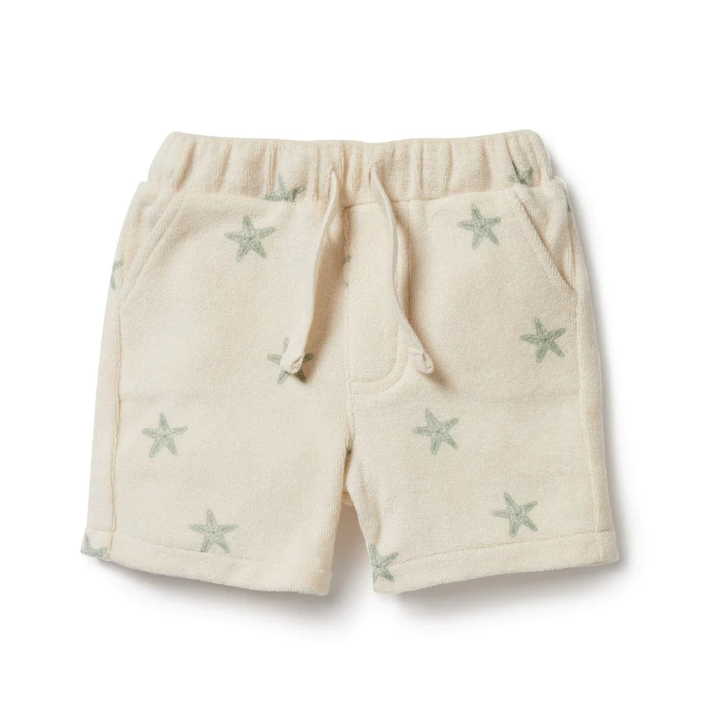 This Wilson and Frenchy terry towelling short delivers a perfect fit for summer fun. Crafted from organic fabric, it features a functional tie front, this short provides your little one with unrestricted comfort and movement all day long. Enjoy carefree playtime in style and comfort. Ships to Canada & US Duty Free.