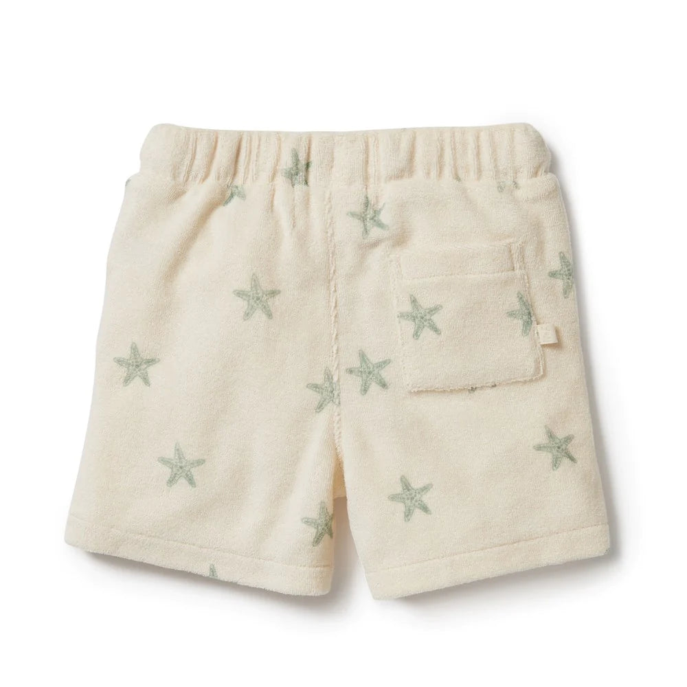 This Wilson and Frenchy terry towelling short delivers a perfect fit for summer fun. Crafted from organic fabric, it features a functional tie front, this short provides your little one with unrestricted comfort and movement all day long. Enjoy carefree playtime in style and comfort. Ships to Canada & US Duty Free.