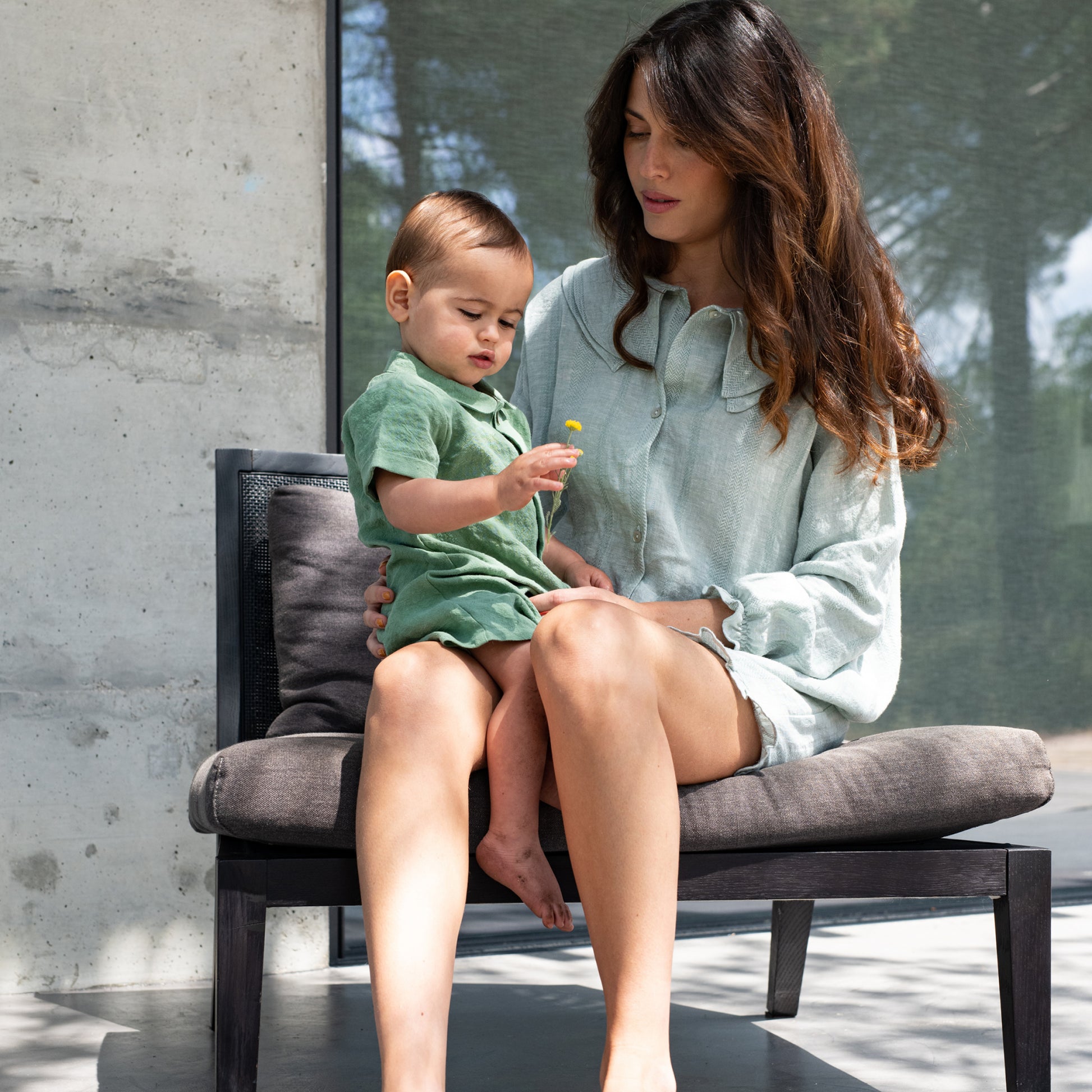 Suuky Porto Green Linen Romper, Oyster Buttons. Premium Portuguese linen. made in Portugal. Sizes 3-6 months to 18-24 months. Short sleeve with collar. Perfect for polo club, palm beach vacation, garden wedding. First birthday gift. free shipping to Canada and the US on orders over $100, with standard shipping rates of $6 CAD / $4.30 USD for orders below. Plus, rest assured, duties into the United States are included